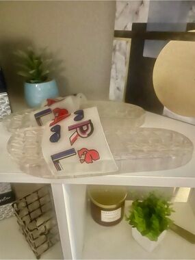 Clear Jelly Slides with Decorative White Strap by Karl Lagerfeld.